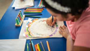 therapeutic project in psychomotor skills : a child doing an psychomotor exercice with a pen