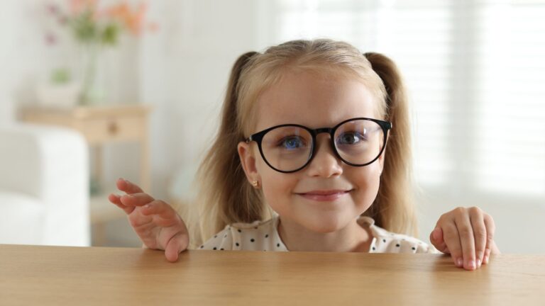 Glasses for children : a blonde child with glasses